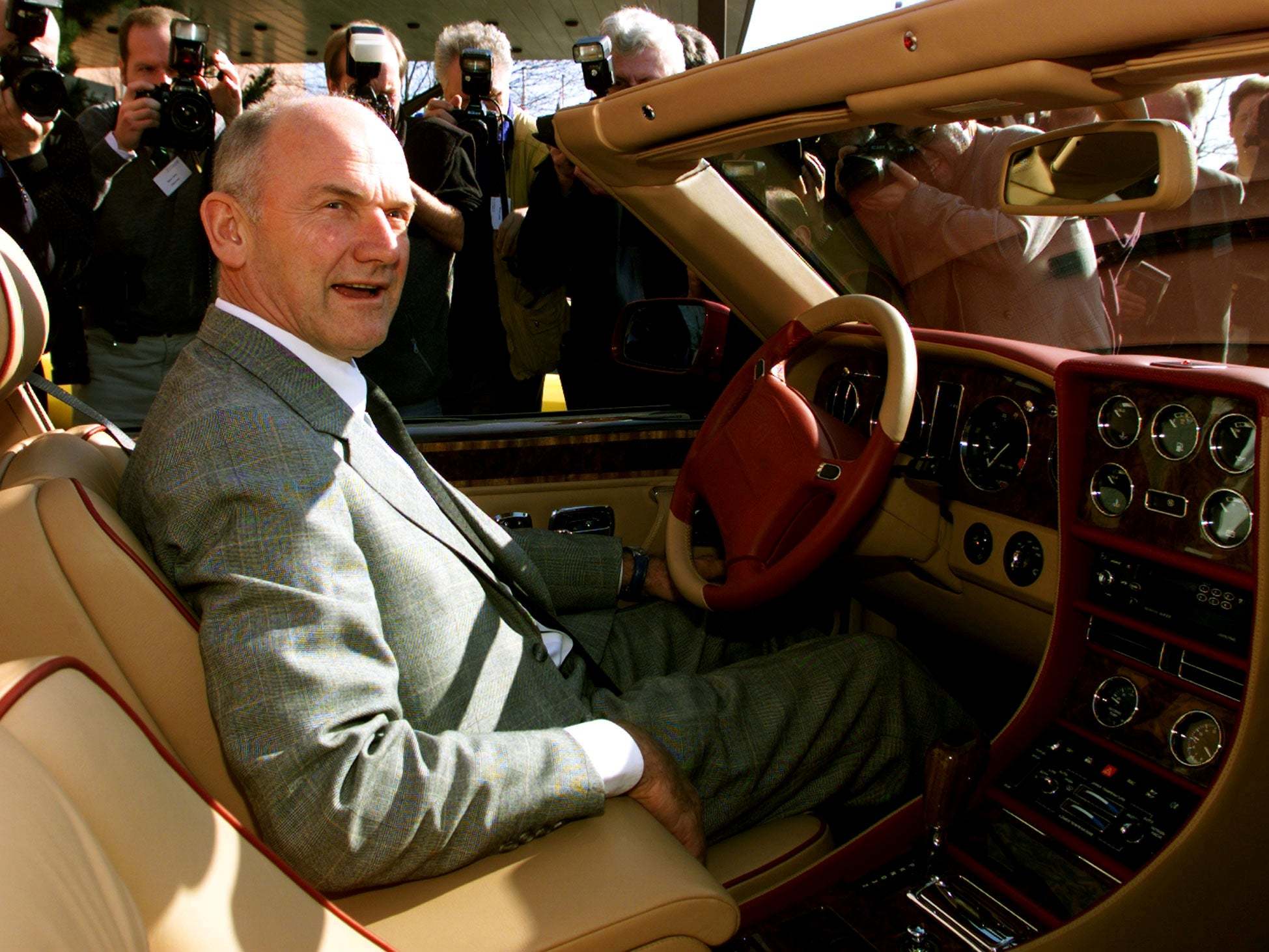 Ferdinand Piech, who lived and breathed cars throughout his successful career, is seen here in a Bentley model after VW bought the classic British carmaker