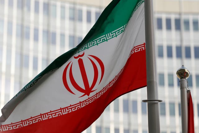 The Iranian flag flutters in front the International Atomic Energy Agency
