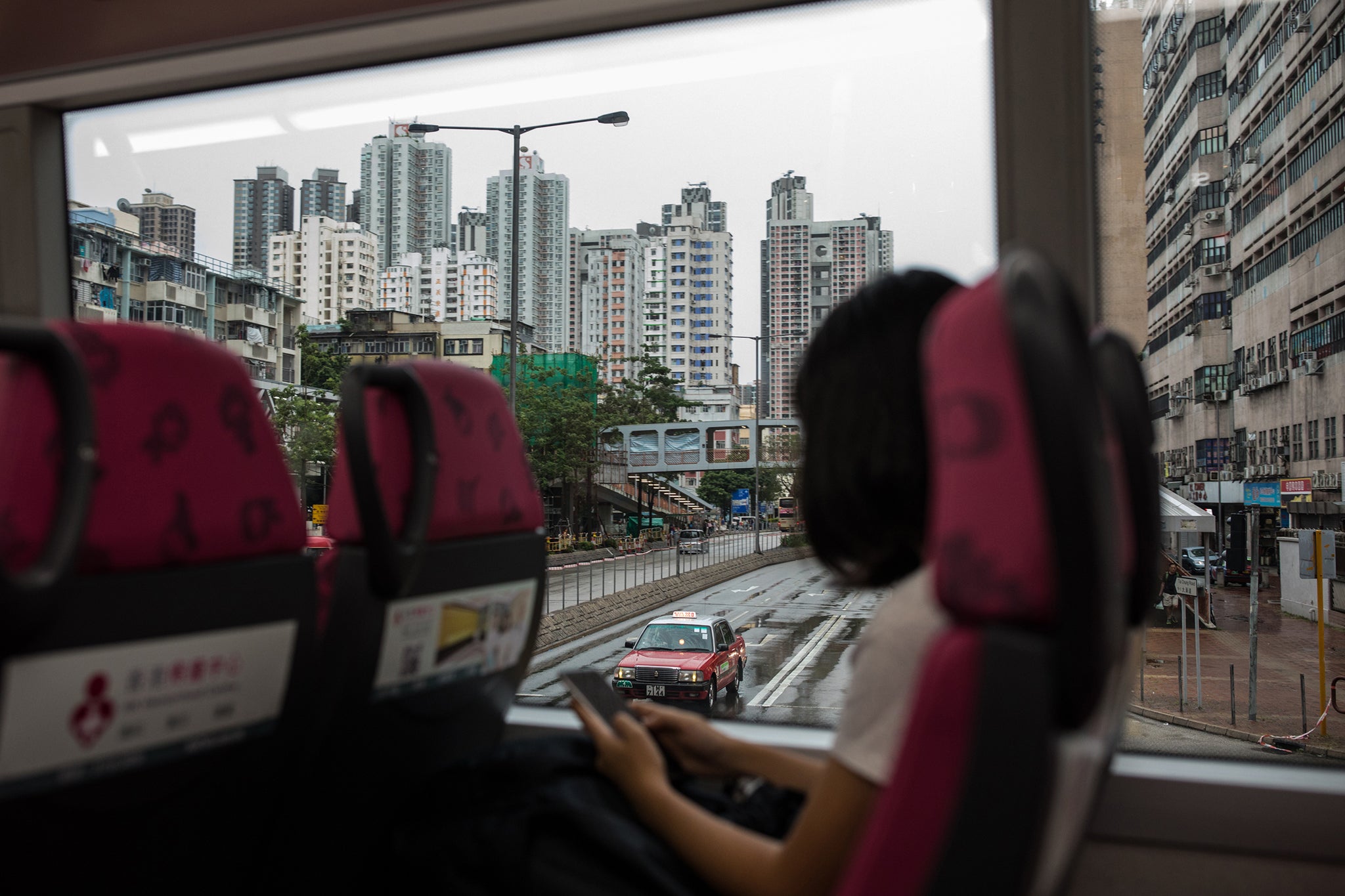 Gigi takes a bus from the Tuen Mun neighbourhood to Tsim Sha Tsui, where she will take a ferry to Hong Kong island to join the protest