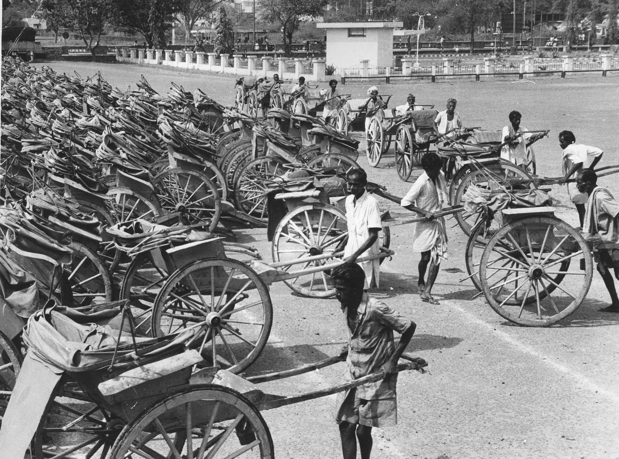 A ban forbidding the use of man-drawn rickshaws came in around 1950