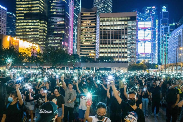 Teenagers sing 'Do You Hear...' at a rally in Hong Kong on 22 August