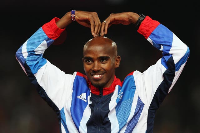 Gold medalist Mohamed Farah of Great Britain celebrates on the podium during the medal ceremony for the Men's 5000m on Day 15 of the London 2012 Olympic Games at Olympic Stadium on August 11, 2012 in London, England