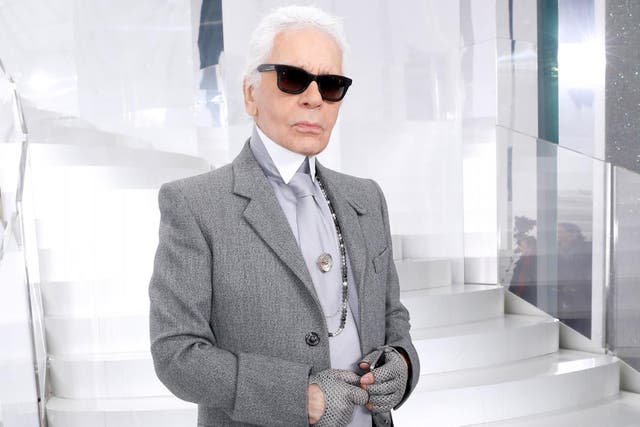 Fashion designer Karl Lagerfeld poses backstage after the Chanel show as part of Paris Fashion Week Haute Couture Spring/Summer 2014 on January 21, 2014 in Paris, France