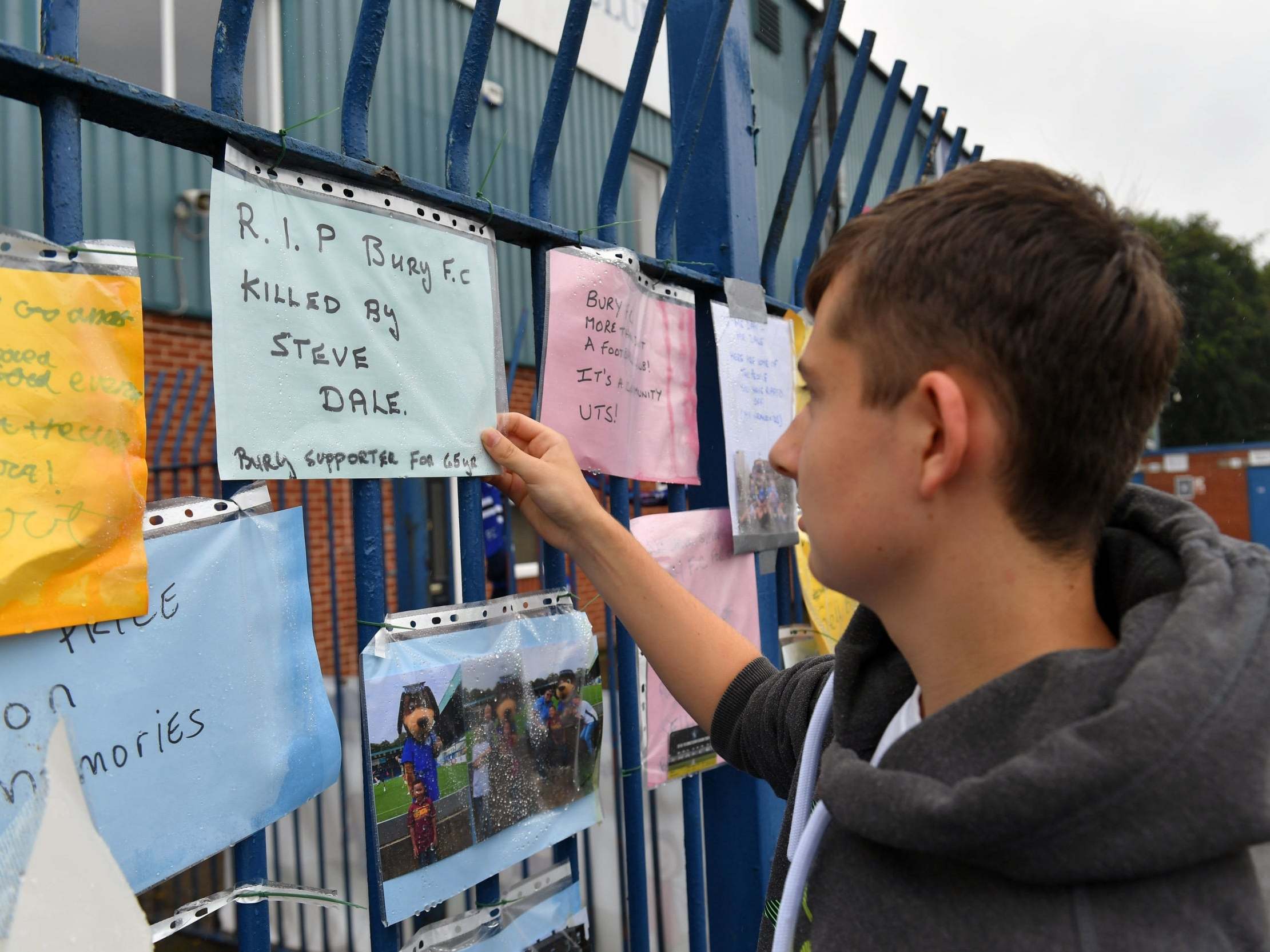 Fans leave messages on the Gigg Lane gates