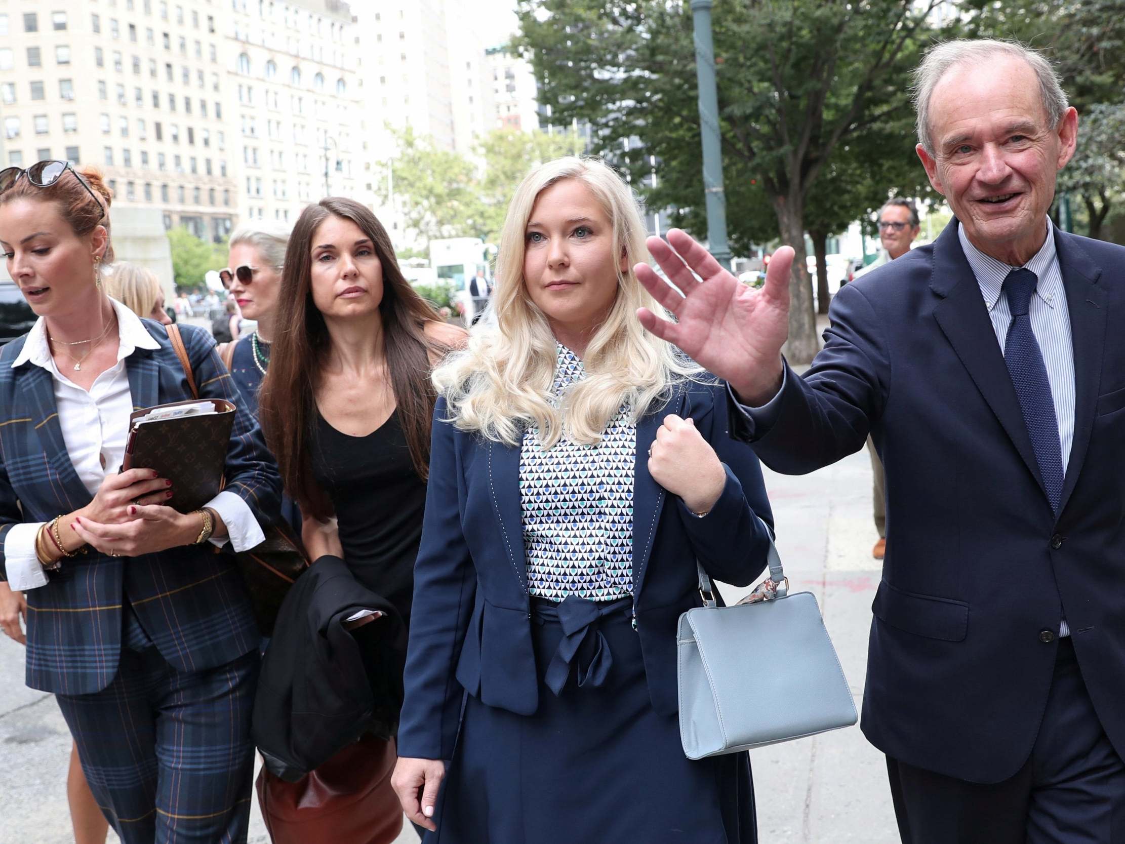 Virginia Giuffre, one of Epstein’s accusers, arrives with her lawyer for a hearing in the criminal case against Jeffrey Epstein in August (Reuters)