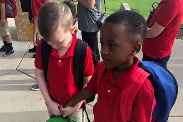 Photo of eight-year-old consoling classmate with autism goes viral