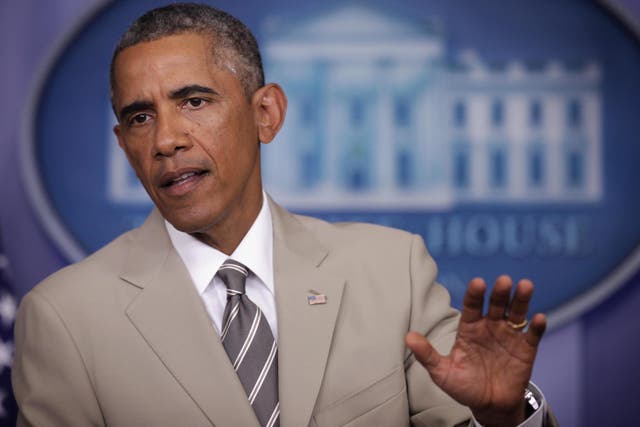 Related video: Barack Obama wears tan suit by tailor Georges de Paris at White House briefing in 2014