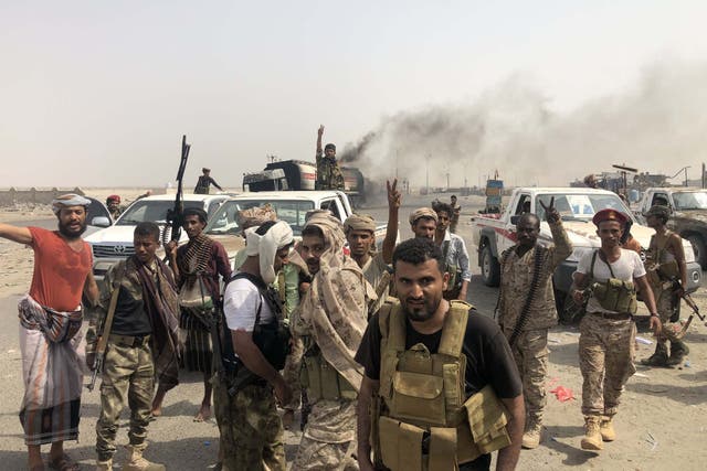 Fighters of the UAE-trained Security Belt Force, dominated by members of the Southern Transitional Council (STC) which seeks independence for south Yemen, flash the V-sign of victory at the al-Alam crossroads on the eastern entrance Aden from the Abyan province in southern Yemen
