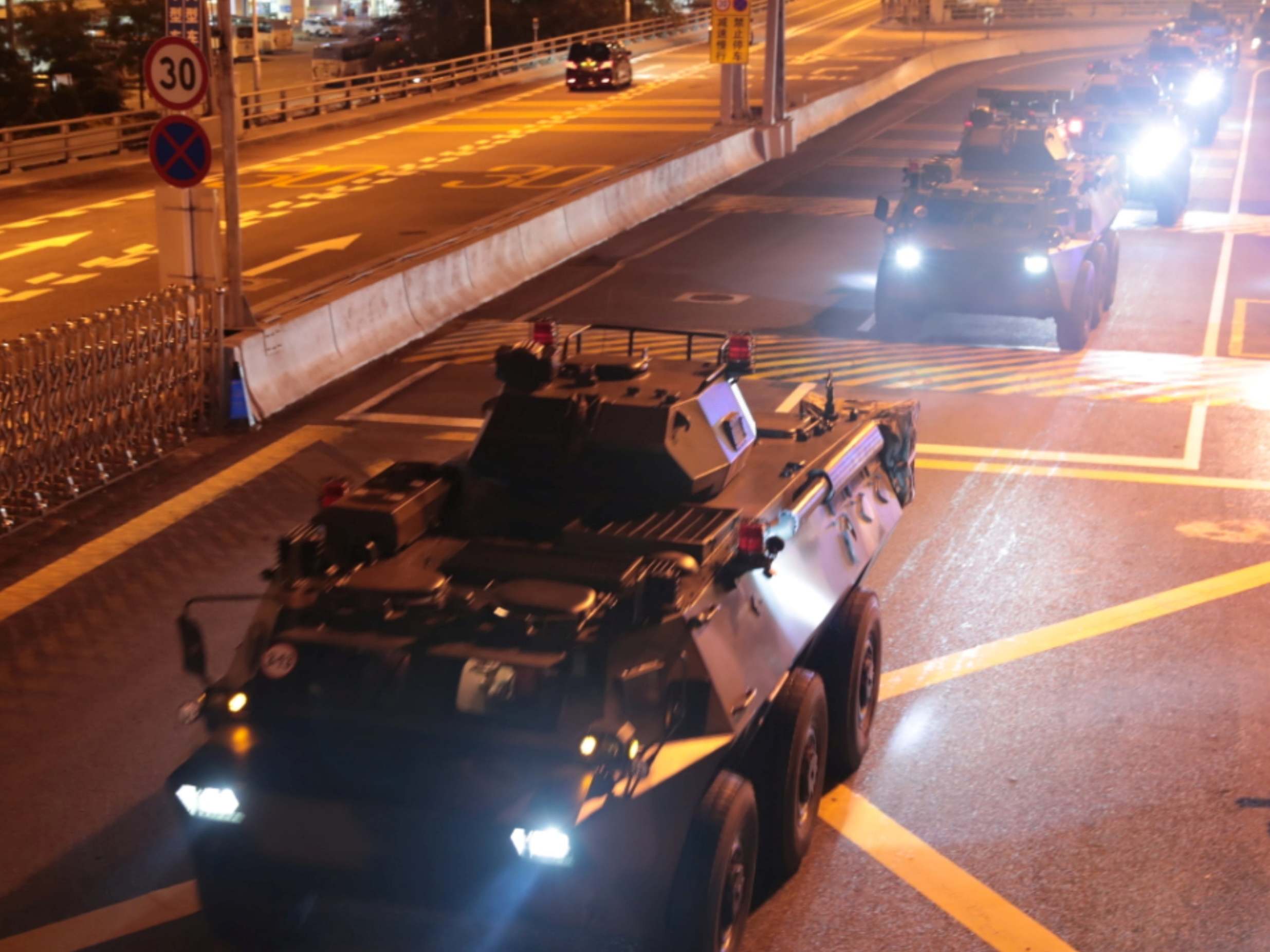 Military vehicles of the Chinese People's Liberation Army (PLA) enter Hong Kong
