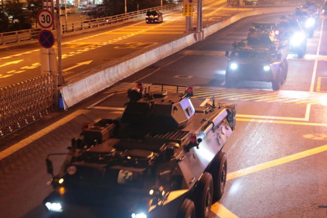 Military vehicles of the Chinese People's Liberation Army (PLA) enter Hong Kong