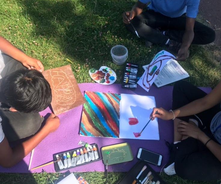 Children drawing during an art activity run by the Refugee Youth Service