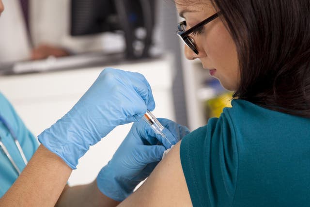 File image of patient receiving flu vaccination.