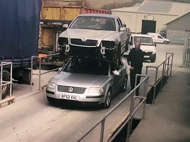 Glyndwr Wyn Richards was given a fine and three penalty points after he was caught driving a car with another car on its roof in Aberystwyth, Wales, 26 March 2019.