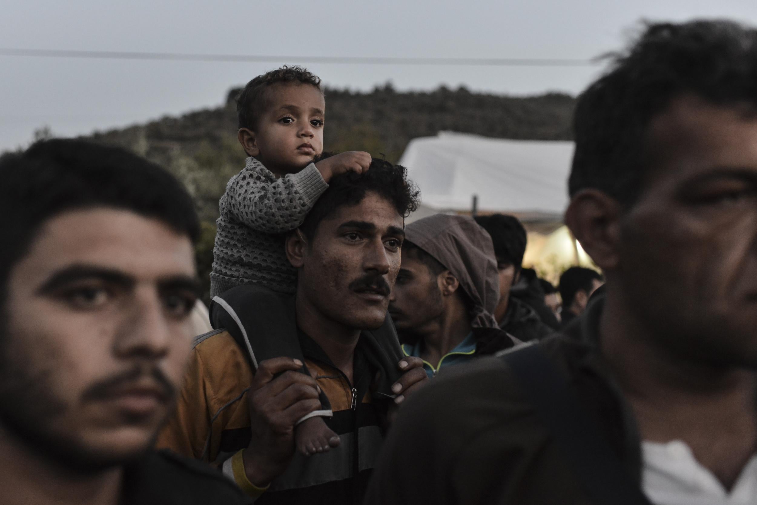 Refugees and migrants protest outside the Moria detention centre in 2017 (AFP/Getty)