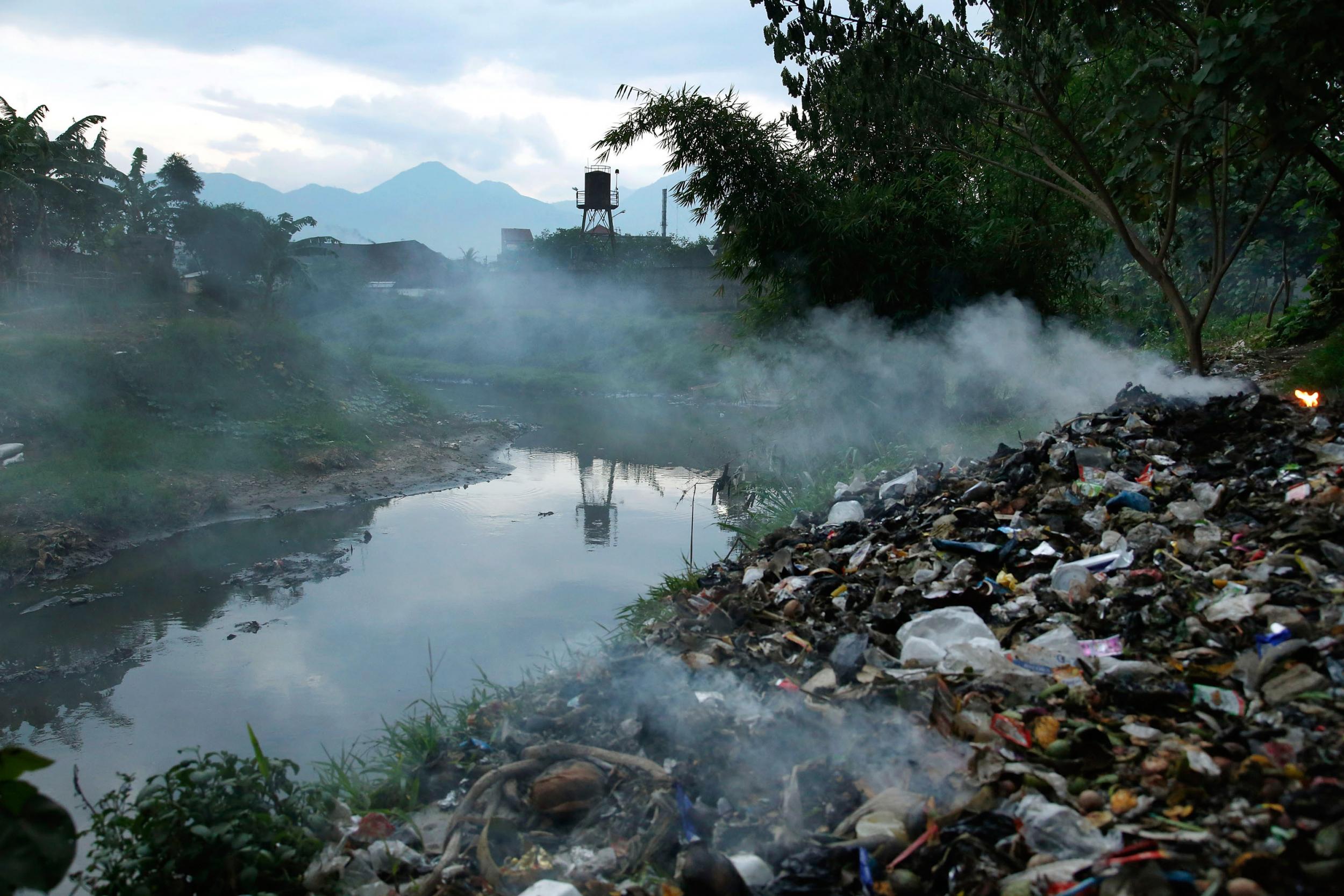 Burning?waste beside?the Citarum river, near the town of a major textile producer in Majalaya, Indonesia?(Getty)