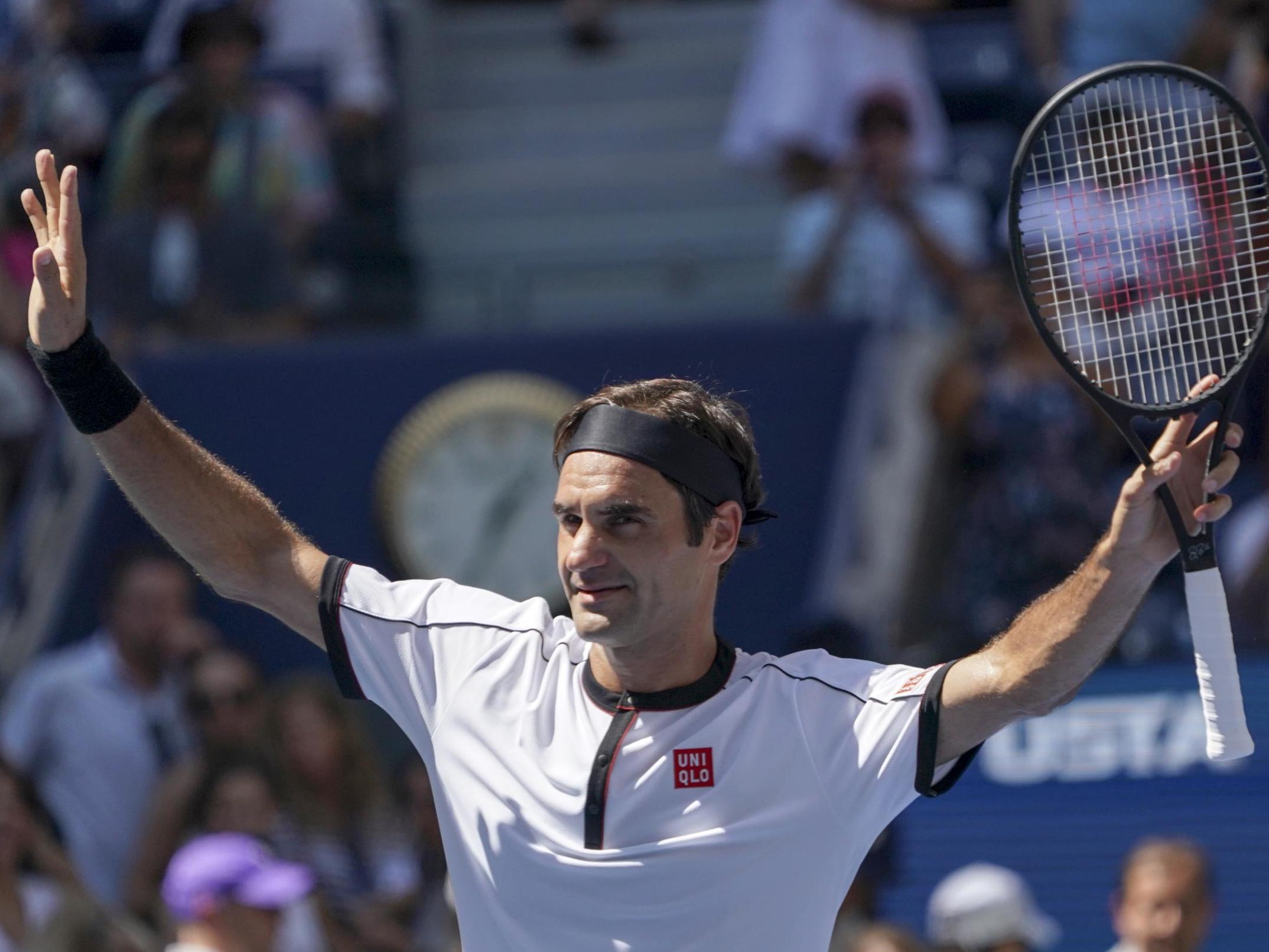 Roger Federer celebrates his win over Dan Evans