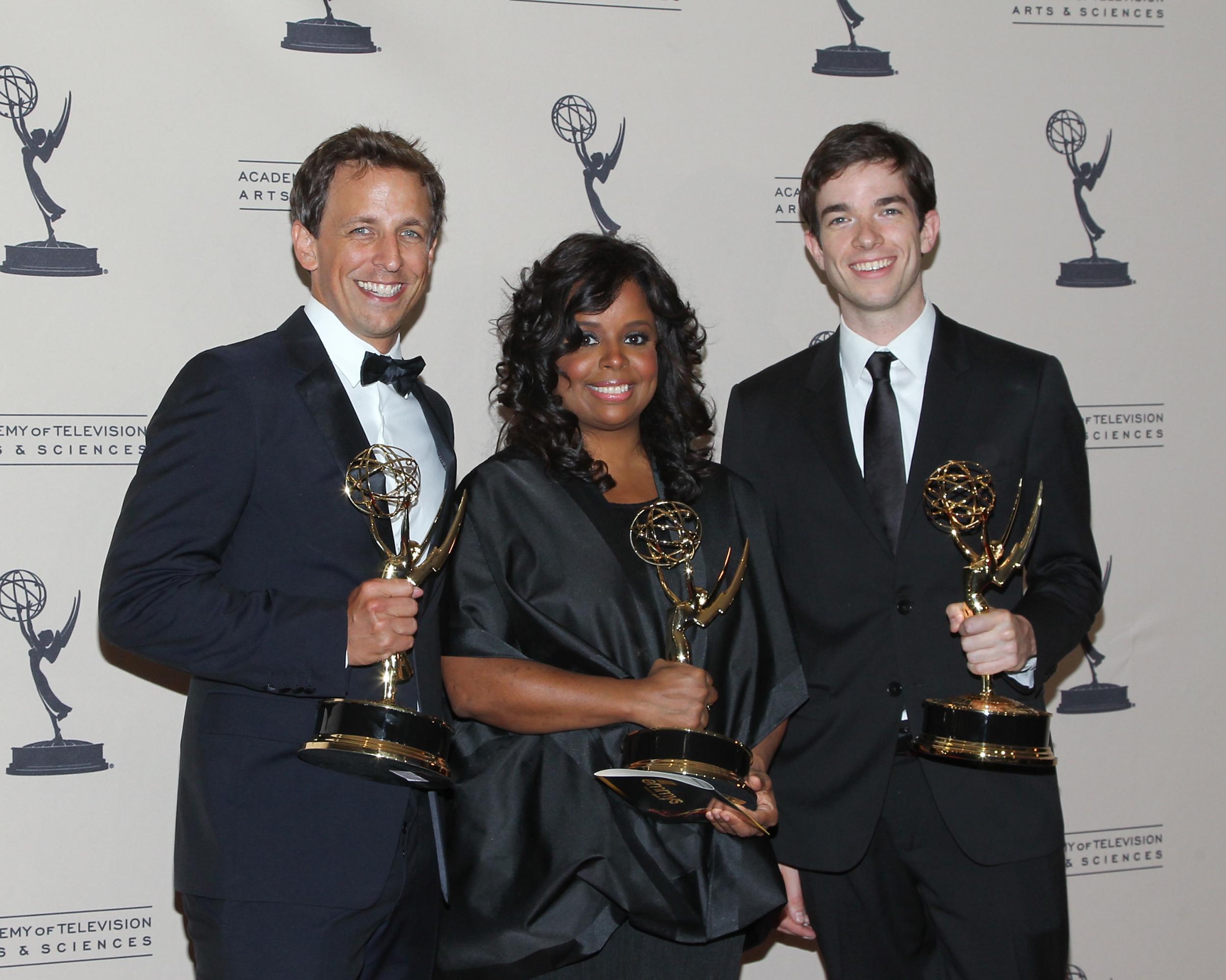 Barnes, Seth Meyers (left) and John Mulaney with their Emmys in 2011 (Getty)