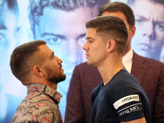 Vasiliy Lomachenko (L) and Luke Campbell (R) face off after speaking to the media