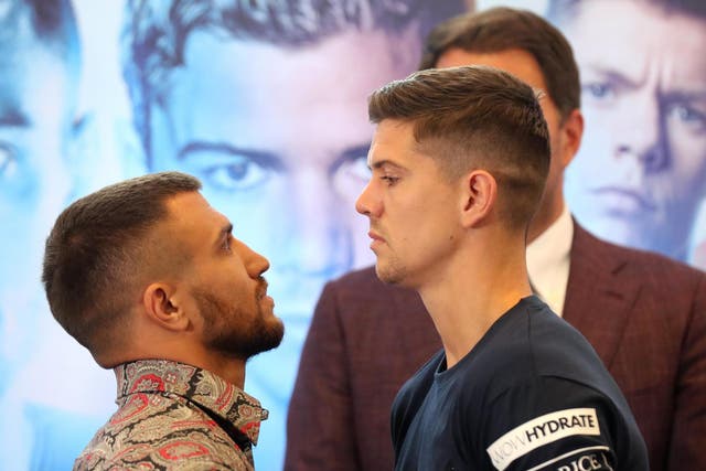 Vasiliy Lomachenko (L) and Luke Campbell (R) face off after speaking to the media