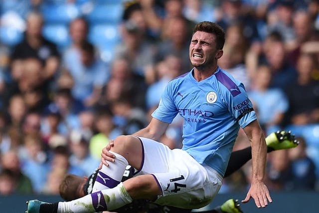 Aymeric Laporte was injured in a challenge by Brighton’s Adam Webster