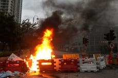 Hong Kong protesters burn barricades on roads after police clashes