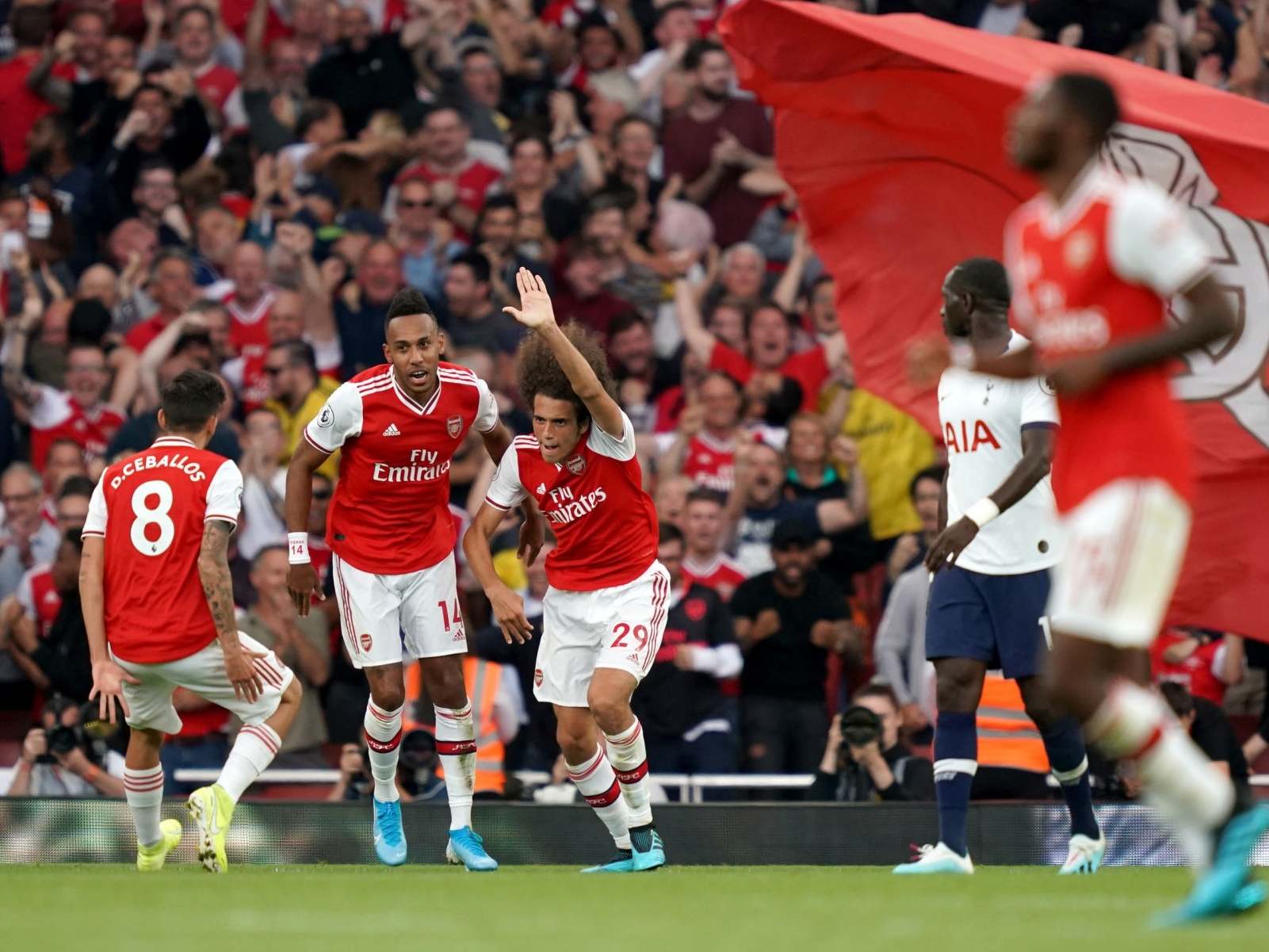 Arsenal celebrate their equaliser vs Spurs