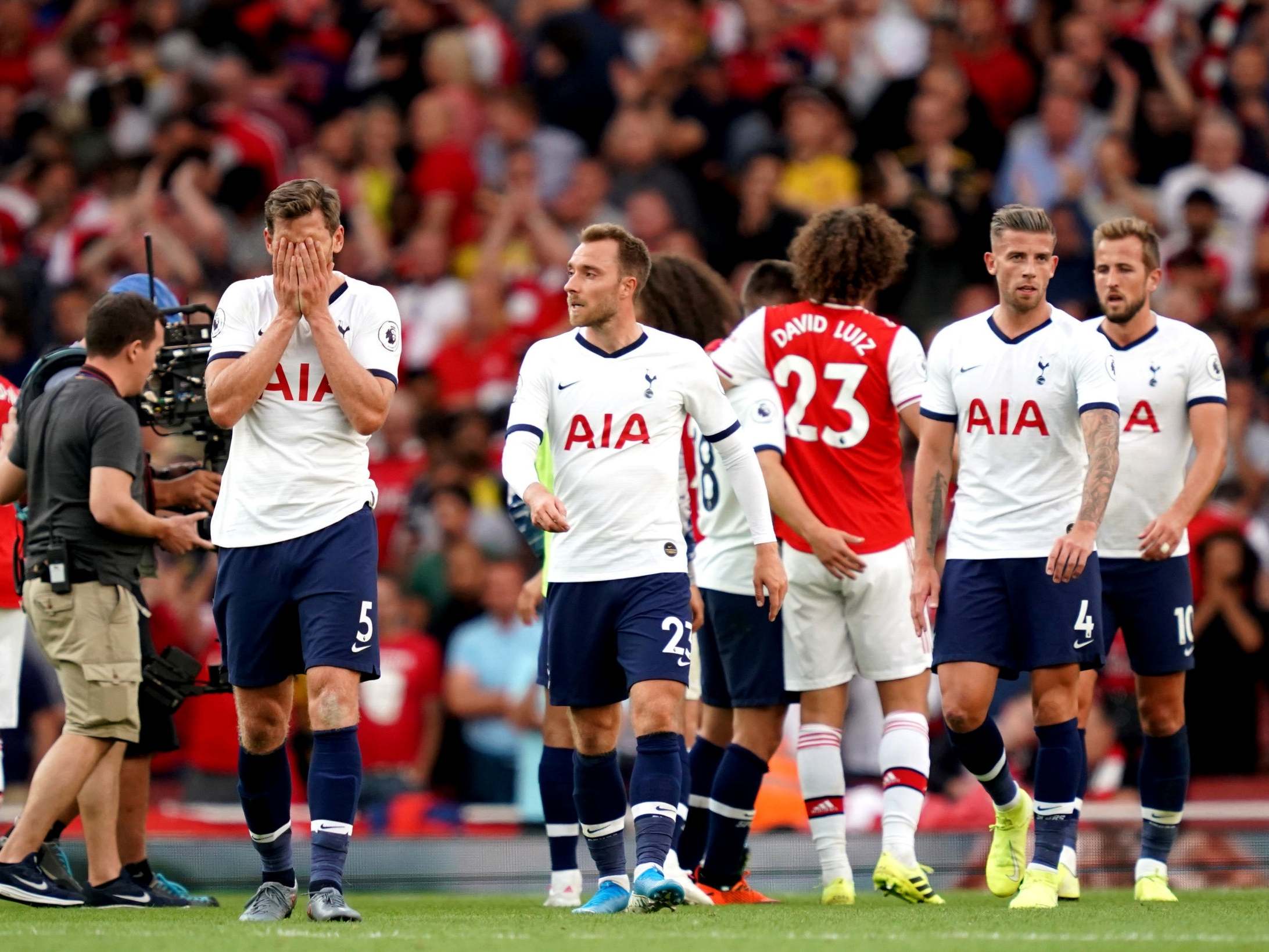 Tottenham players leave the field at full-time