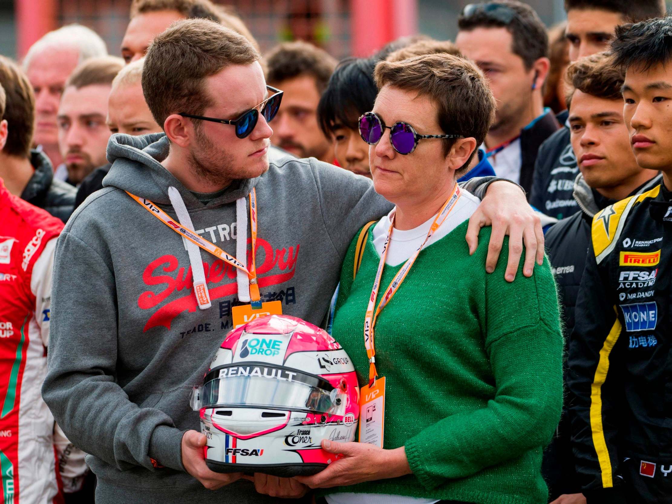 The brother and mother of Anthoine Hubert observe a minute’s silence after the F2 driver’s death