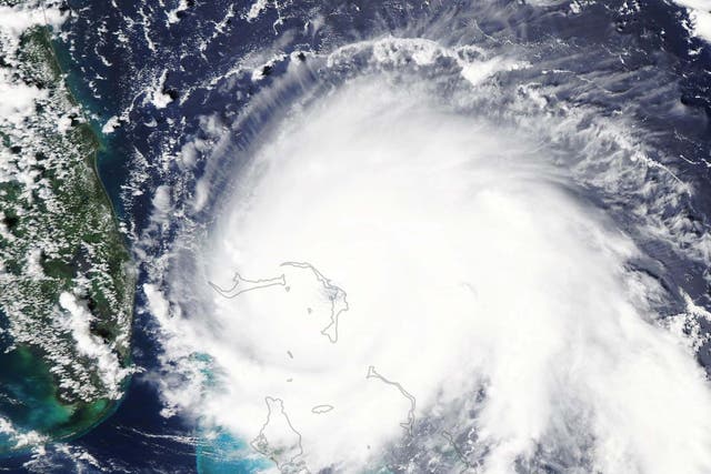 A handout photo made available by NASA shows a natural-color satellite image of Hurricane Dorian at 2:05 pm Eastern Daylight Time