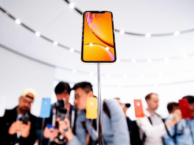 Waiting to buy models such as the Apple iPhone XR, pictured on display above, is often the wiser option, Chen says