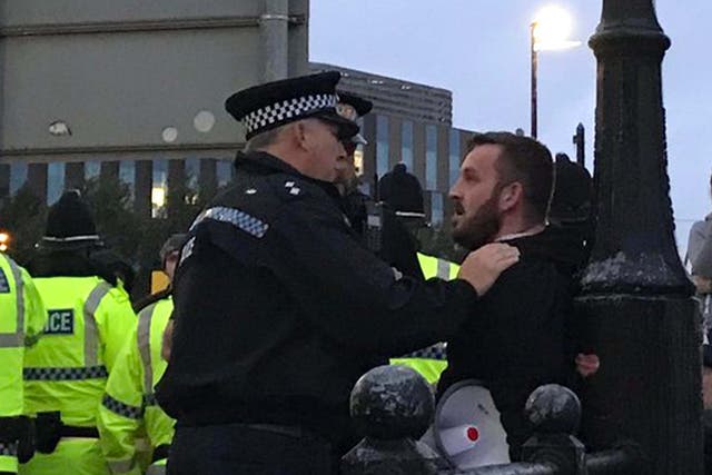 Self-styled 'yellow vest' protester James Goddard spoken to by police outside a Labour rally at The Lowry Theatre, in Salford, 2 September 2019.