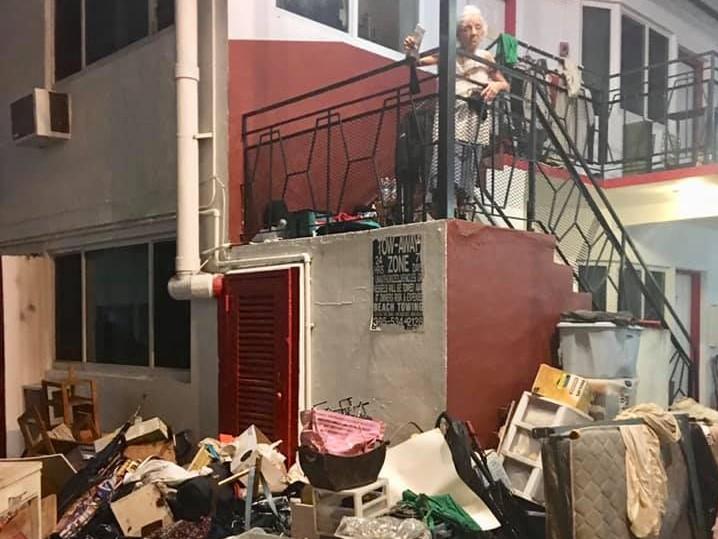 Maria Cazanes, 75, with her belongings left in the street