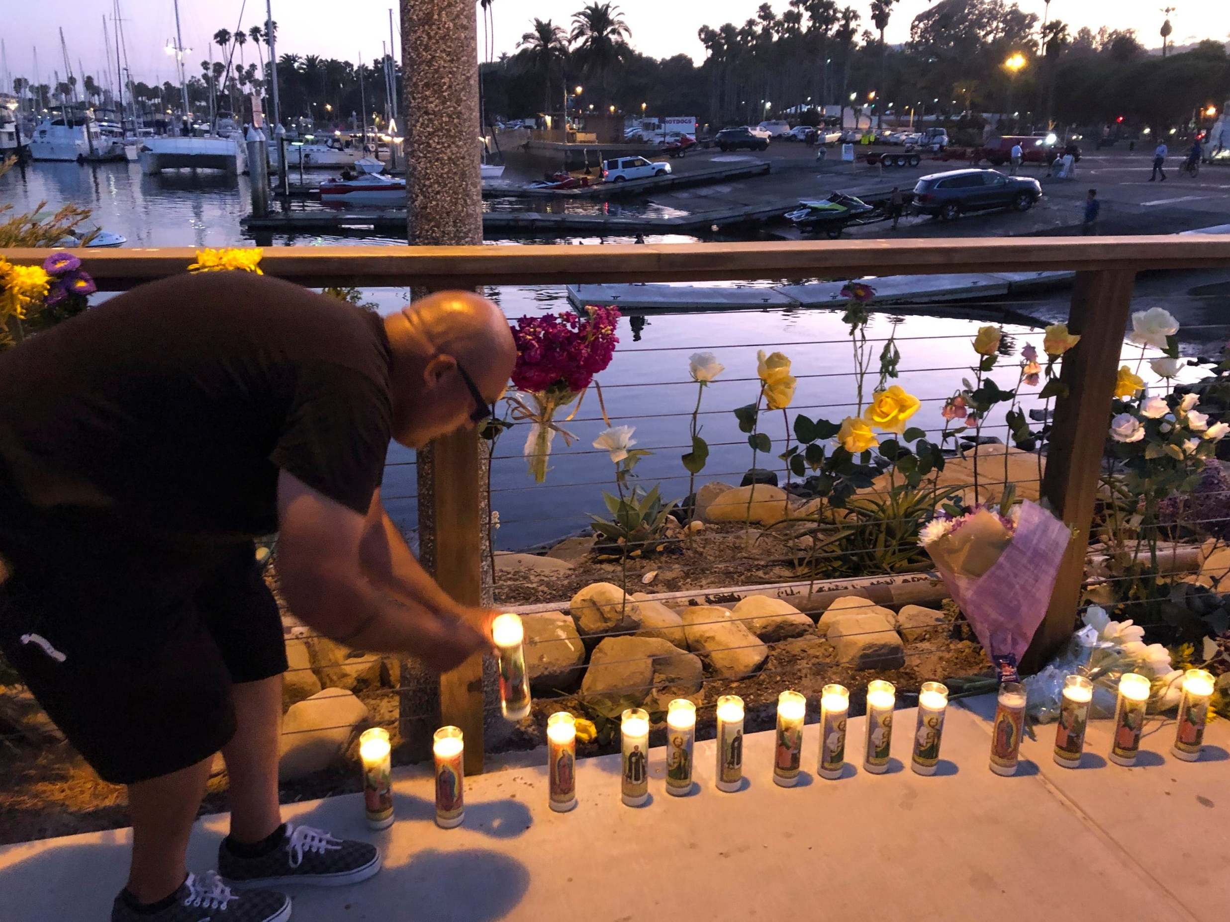 Family and friends of victims lit candles in their honor after the tragedy at sea