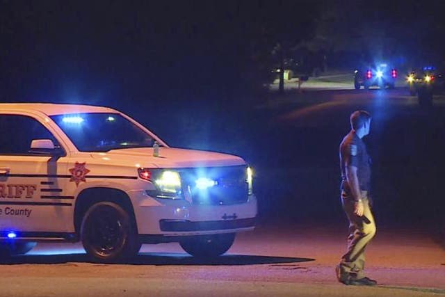In this photo provided by WHNT-TV News, authorities block access to a street, in Elkmont, Ala., Tuesday, Sept. 3, 2019. Authorities in Elkmont say a teenager called 911 about hearing gunshots and then admitted to killing multiple members of his family.