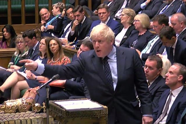 Boris Johnson gestures at the opposition during Prime Minister's Questions in the House of Commons