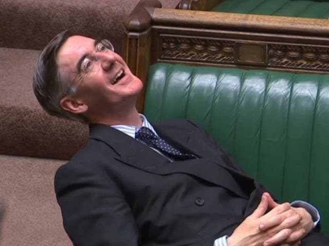Leader of the House of Commons Jacob Rees-Mogg reclining on his seat in the House of Commons