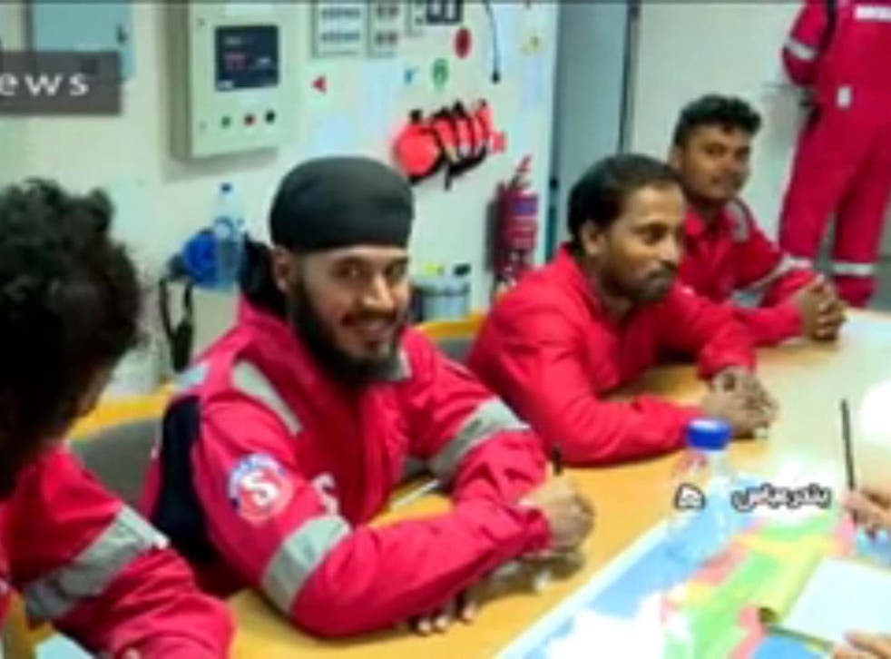 A handout photo made available by Iranian state-run IRIB News Agency shows crew members of the British-flagged tanker Stena Impero