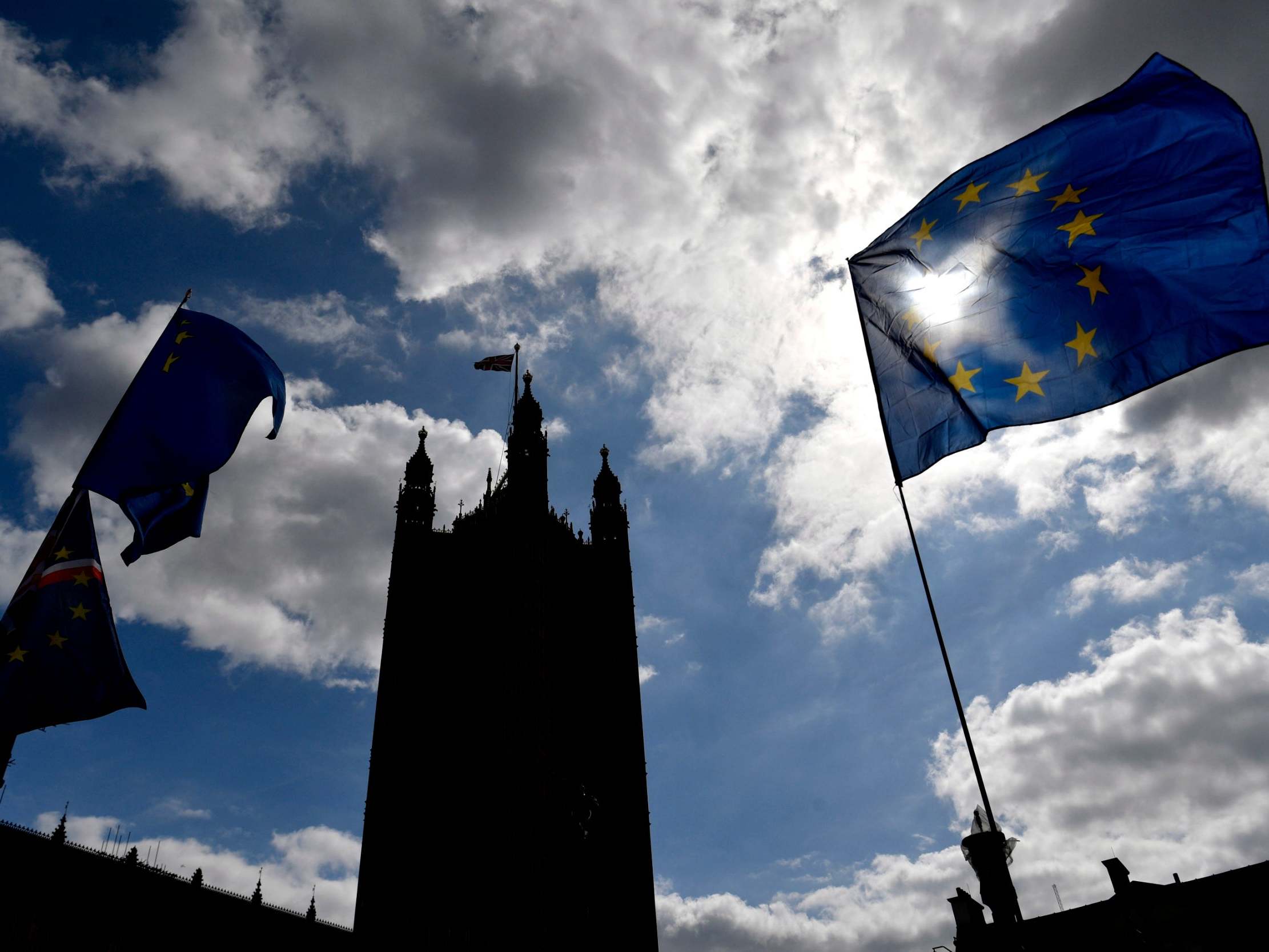 The EU flag flutters outside the Houses of Parliament