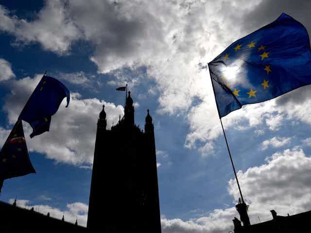 The EU flag flutters outside the British Houses of Parliament in central London