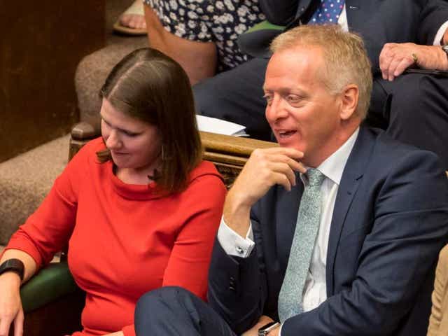 Phillip Lee dramatically crossed the floor to join Jo Swinson on the Liberal Democrat benches as Boris Johnson spoke in the Commons