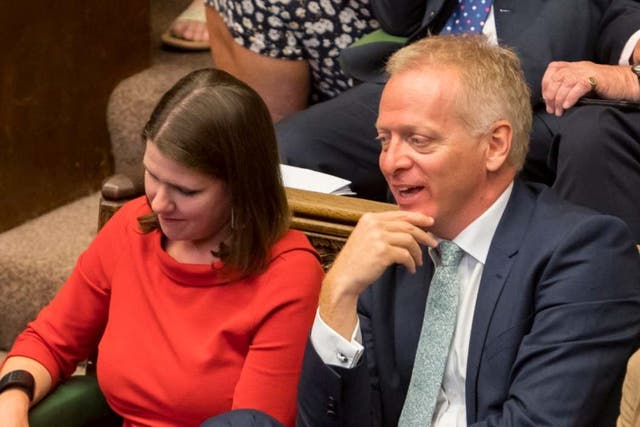 Phillip Lee dramatically crossed the floor to join Jo Swinson on the Liberal Democrat benches as Boris Johnson spoke in the Commons