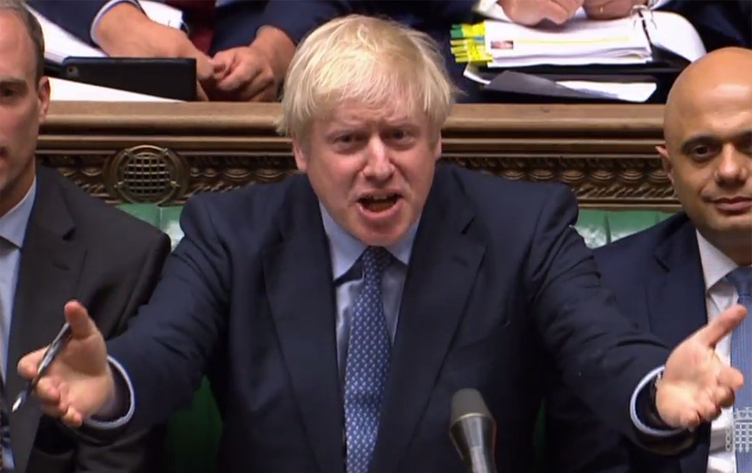 Boris Johnson reacts as Labour Party leader Jeremy Corbyn speaks