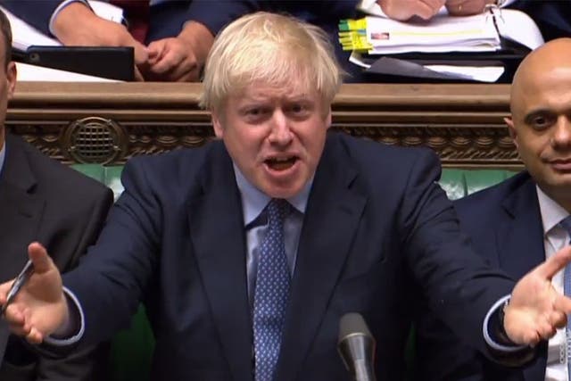 Boris Johnson reacts as Labour Party leader Jeremy Corbyn speaks