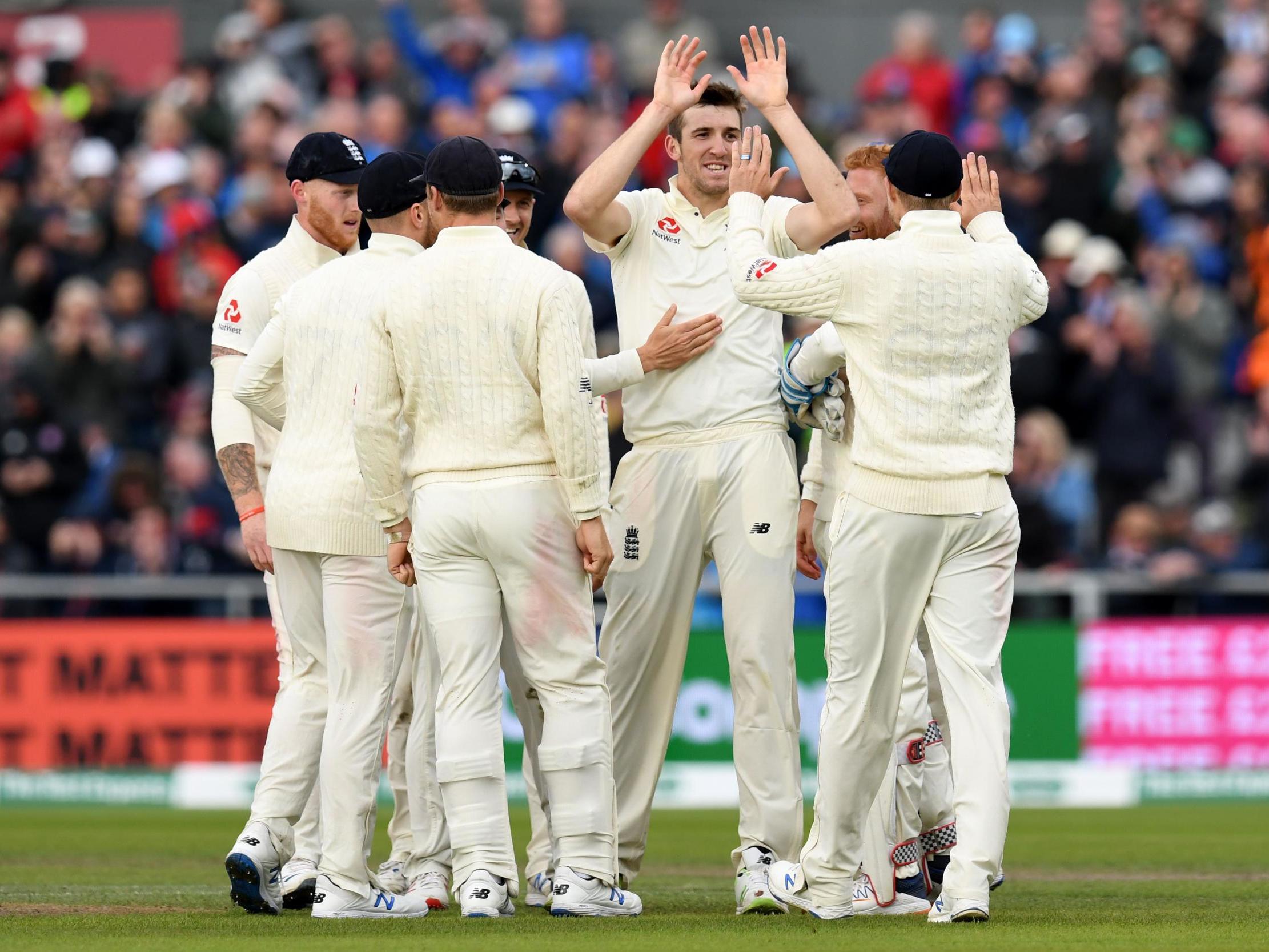 Craig Overton celebrates with teammates after taking the wicket of Marnus Labuschagne