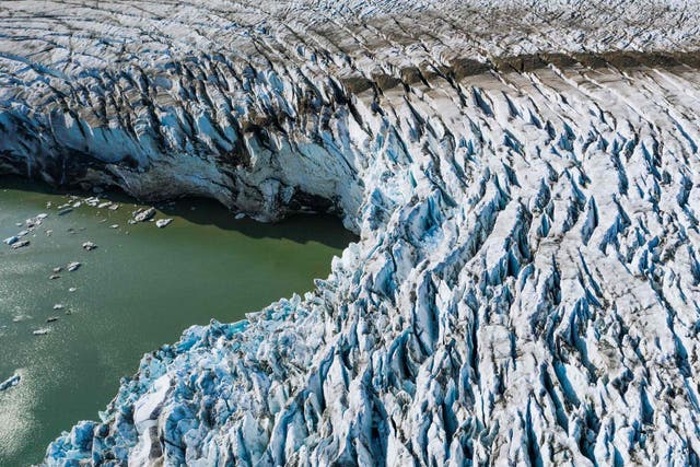 Understanding Arctic feedbacks like this are crucial to understanding how a warming climate will change vulnerable cities. Pictured is an aerial view of the Apusiajik glacier in southeastern Greenland