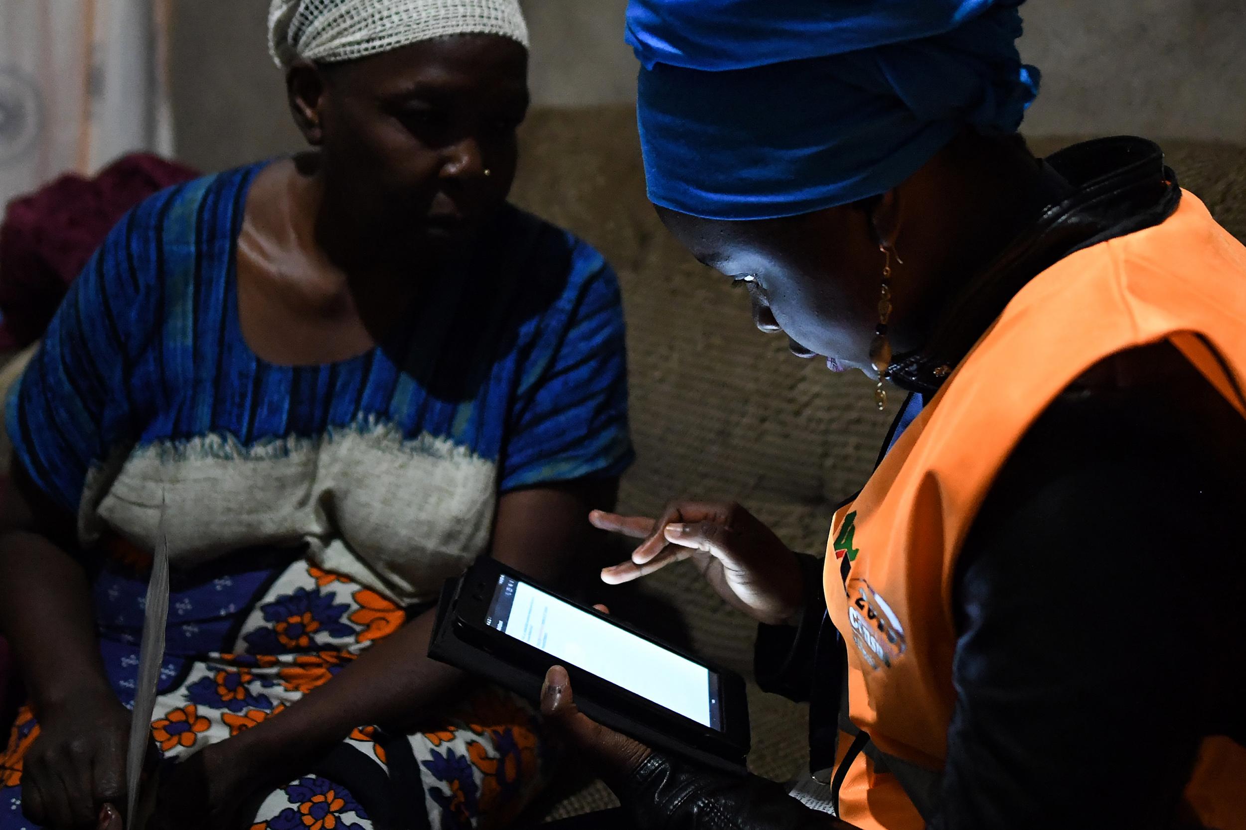 Progress: a woman answers questions in the 2019 population census in Nairobi