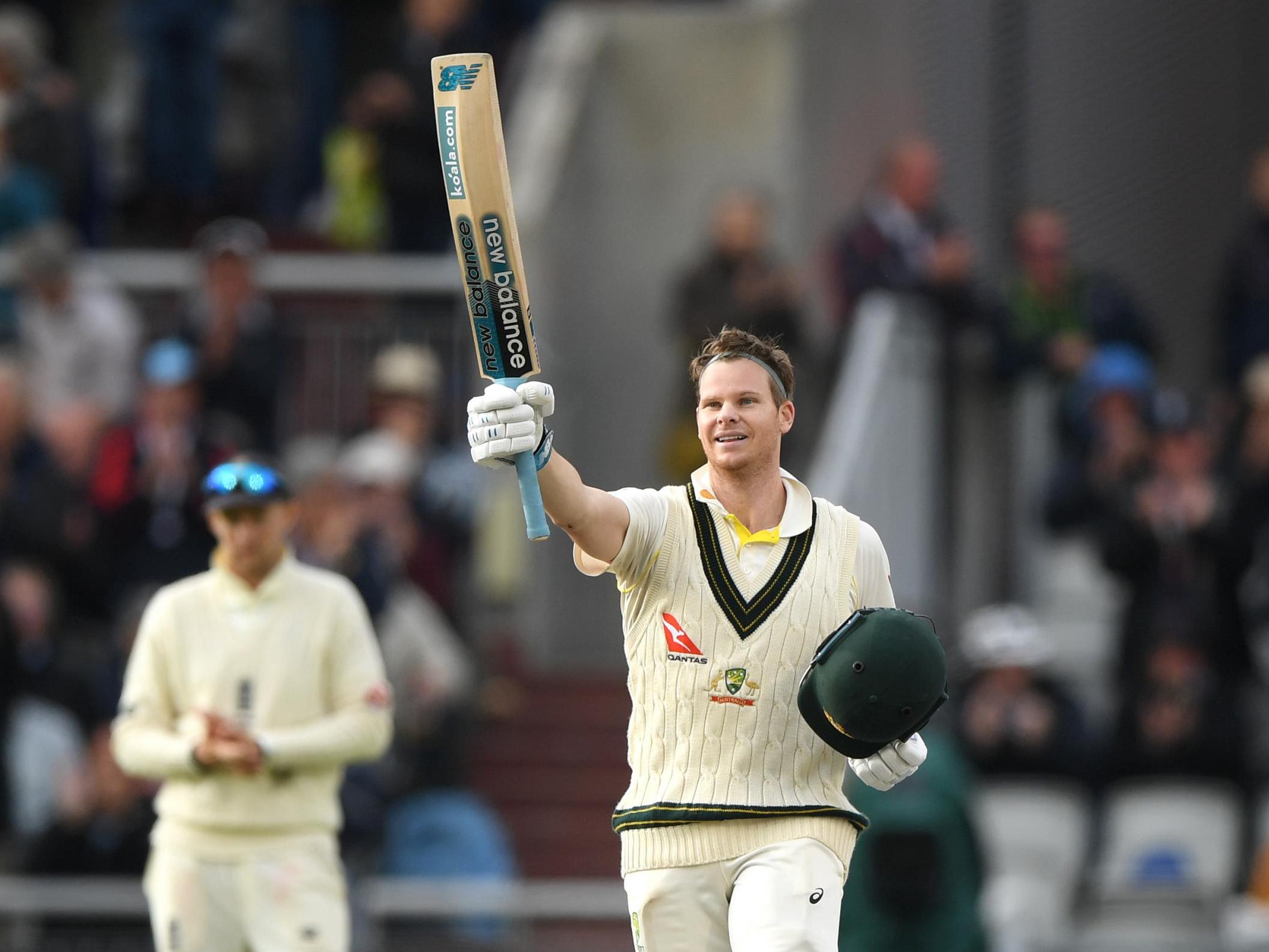 The Australian celebrates after reaching his double century