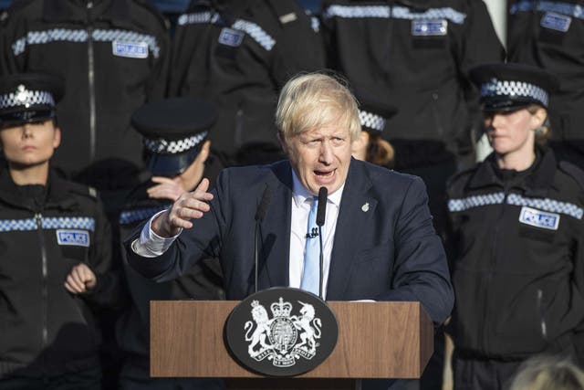 The prime minister gives a speech in Wakefield against a backdrop of officers