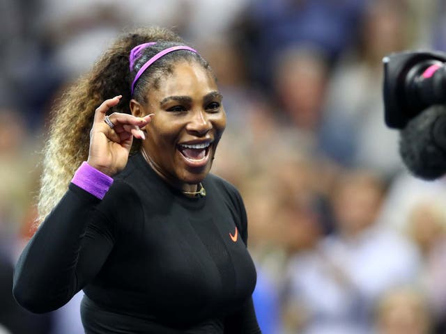 Serena Williams waves to the camera after reaching the final