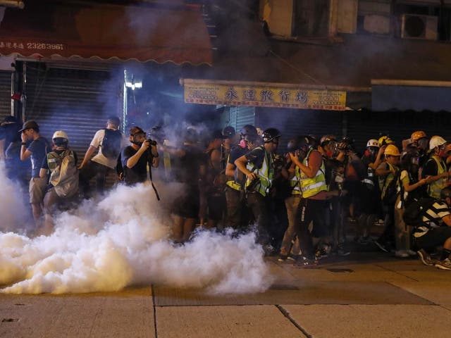Riot police fire tear gas to disperse protesters attending a rally in Mong Kok, Hong Kong, China, 6 September 2019.